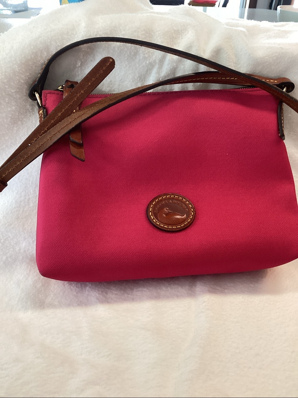 Dooney & Bourke Nylon Crossbody  pink with Brown Strap 
Raspberry color